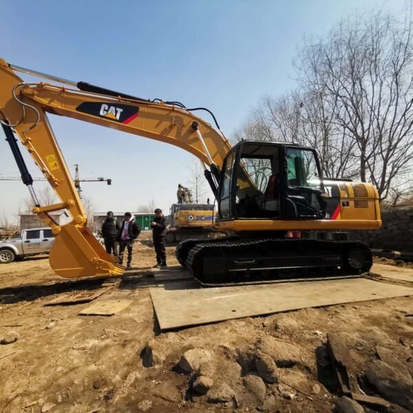 CAT mini excavator for construction work, featuring durable hydraulic arm and tracked undercarriage for stability and efficiency. Ideal for small to medium job sites.