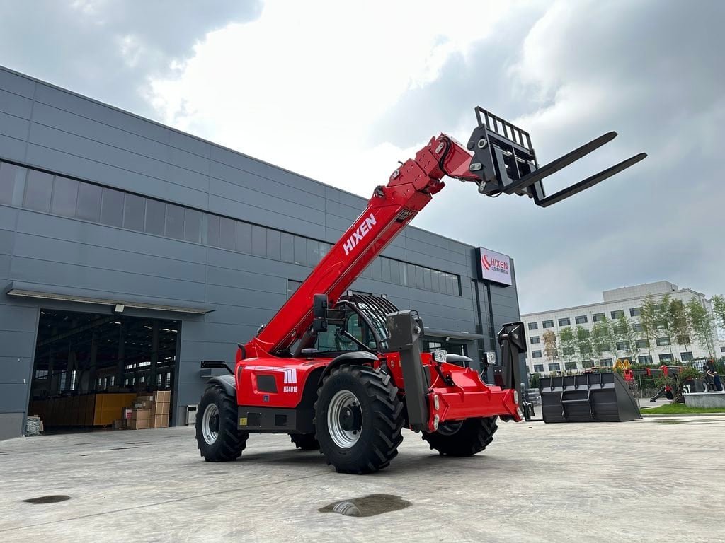 A compact telehandler operating in a warehouse