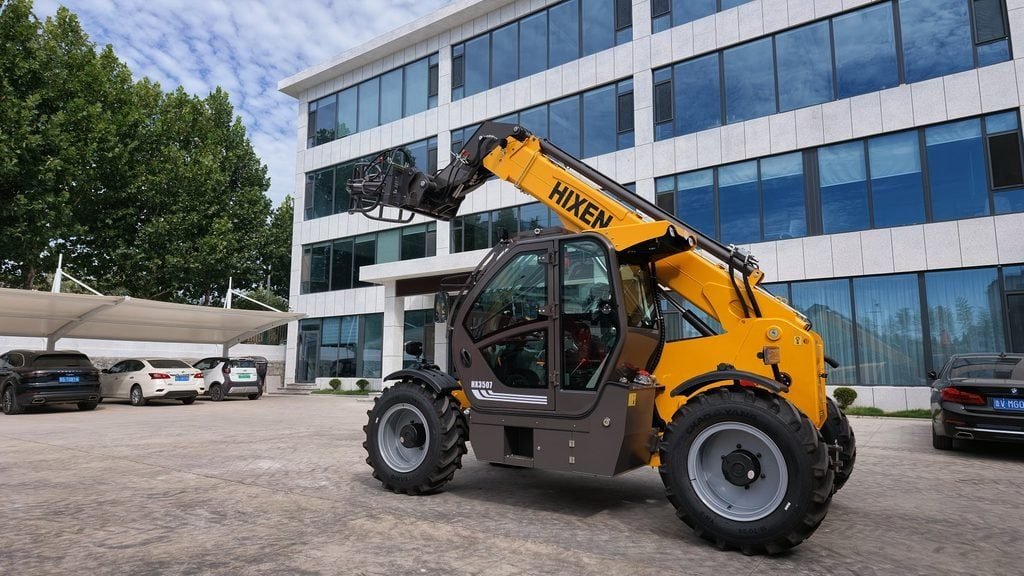 An operator assessing jobsite needs for a telehandler